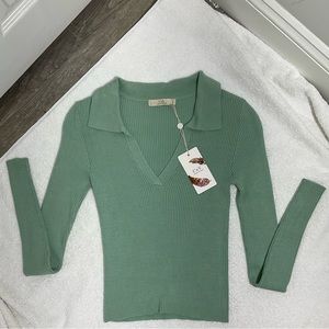 Mint green long sleeved Vneck shirt.